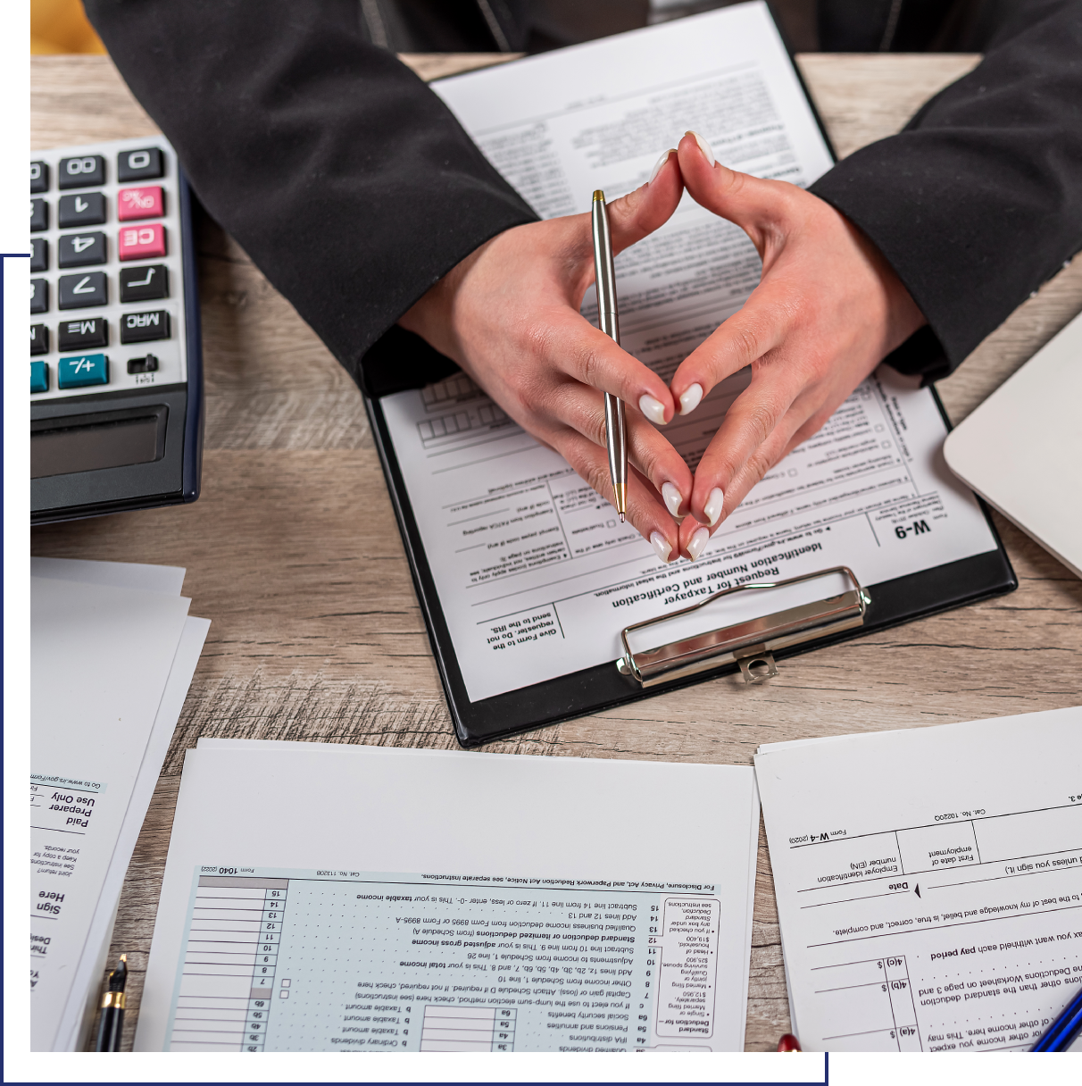 A person is holding their hands over papers